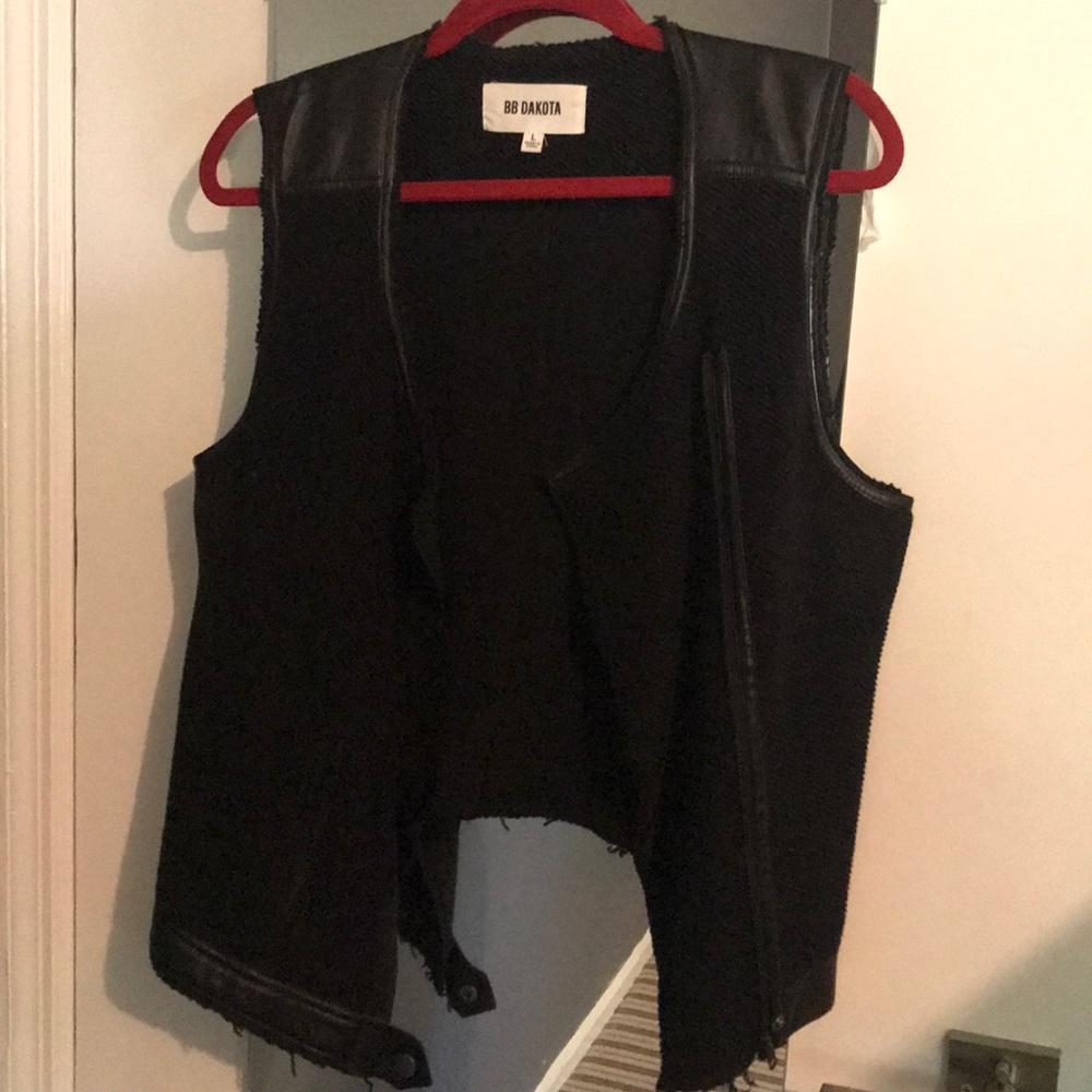 Knit and “leather” detail vest .